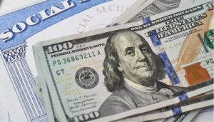 2.8 percent Social Security Increase Announced. Image showcases social security card with $100 bill on top. 