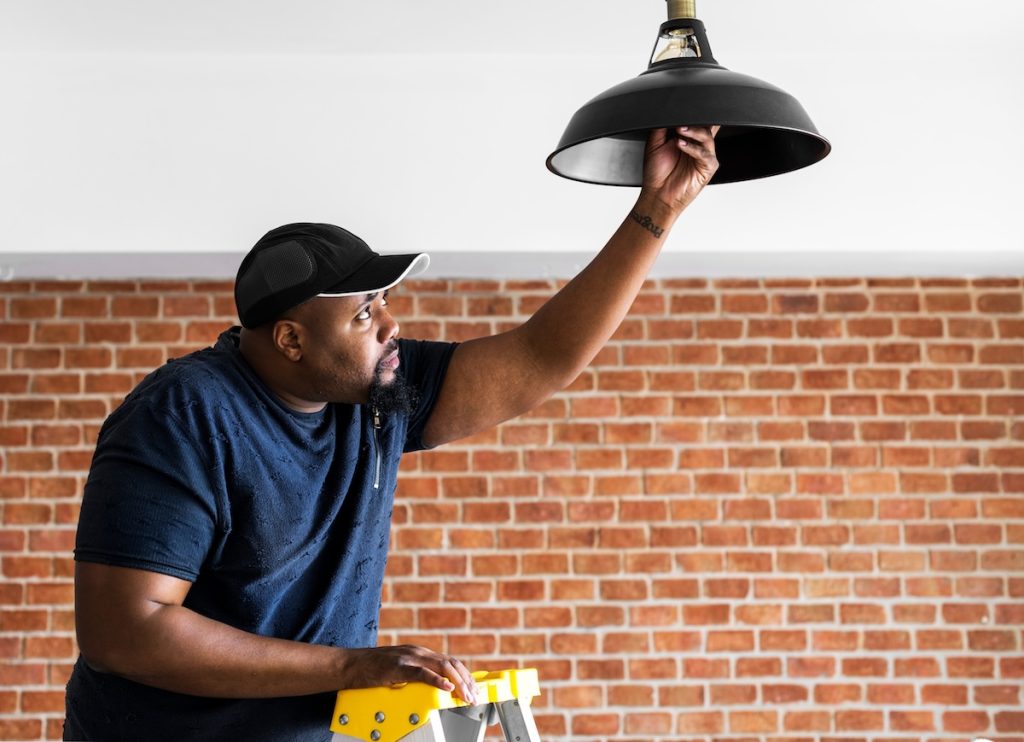 main installing a lightbulb, healthy housing priorities