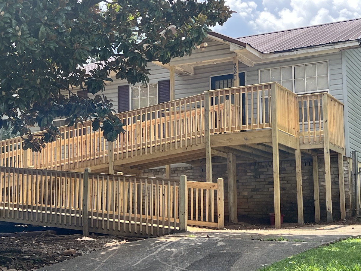 New wooden accessibility ramp attached to a home supported by CDBG community development funding, effective CDBG program