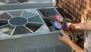 Safe 4th of July on property starts with preventative maintenance. Image shows HVAC inspection. 