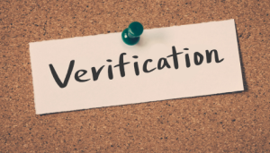Sticky Note of the word verification. 
