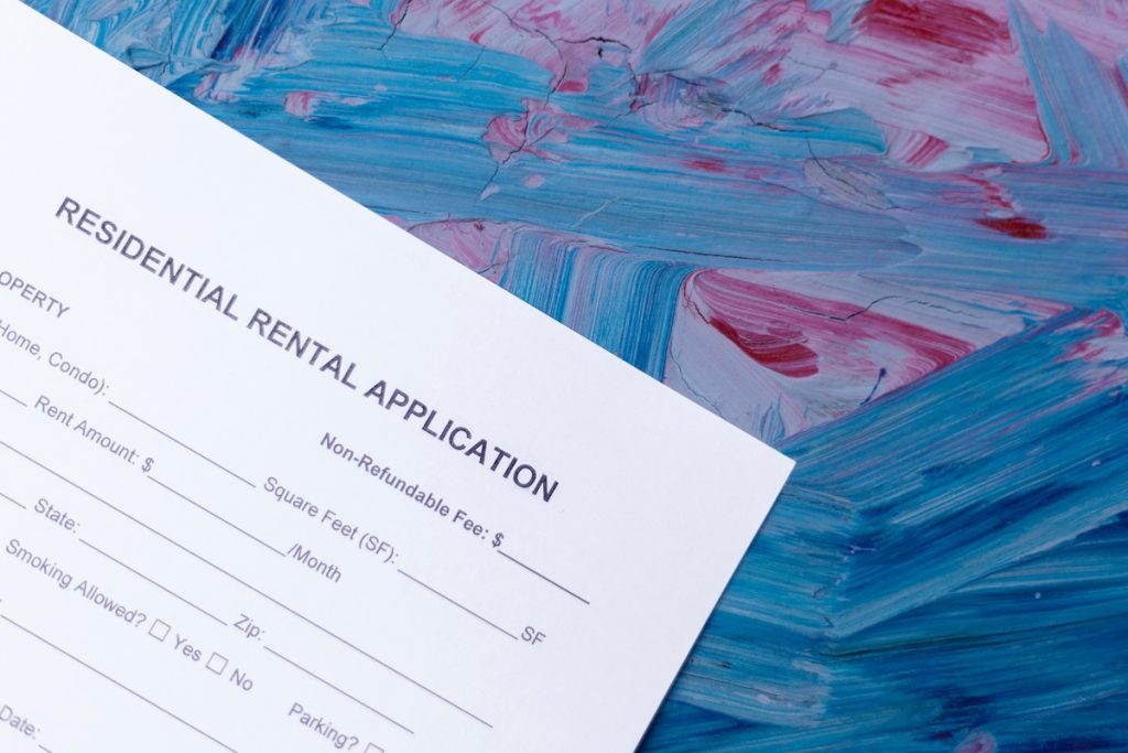Residential rental application on an abstract background, disparate impact standard
