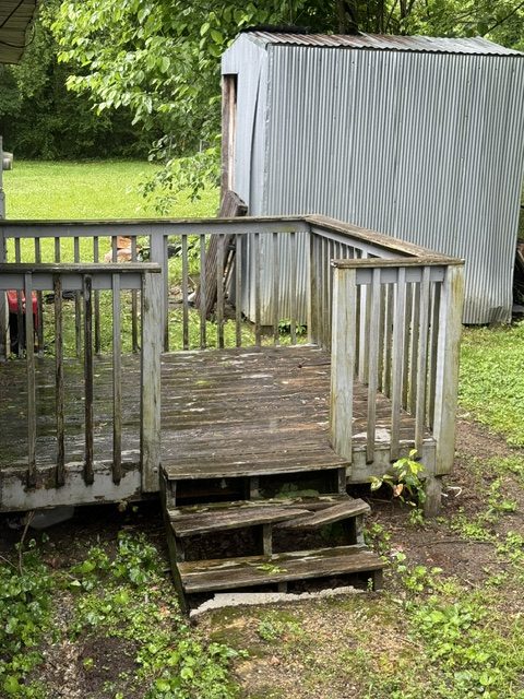 Porch and steps before repair showing an urgent home safety need in Bessemer.