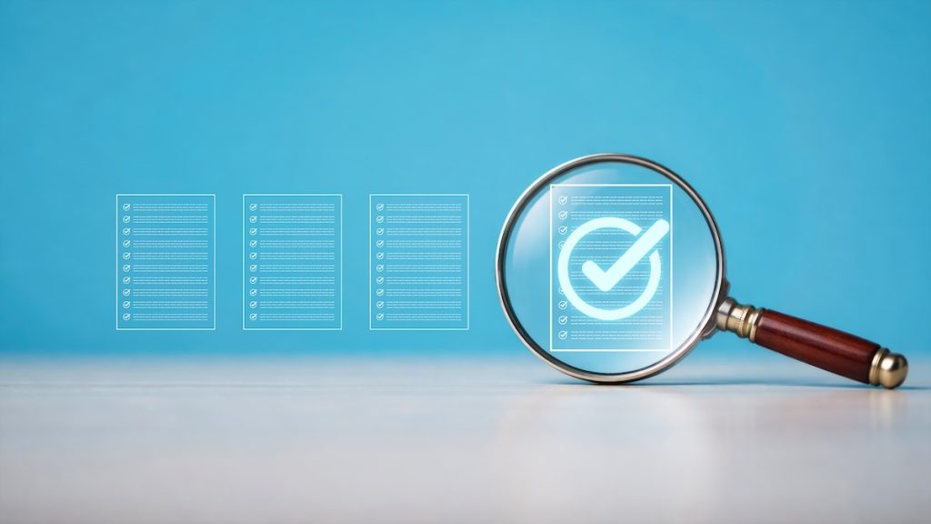 Magnifying glass inspecting digital verification checkmark icons representing document validation data review quality control and compliance technology concept, fair housing compliance